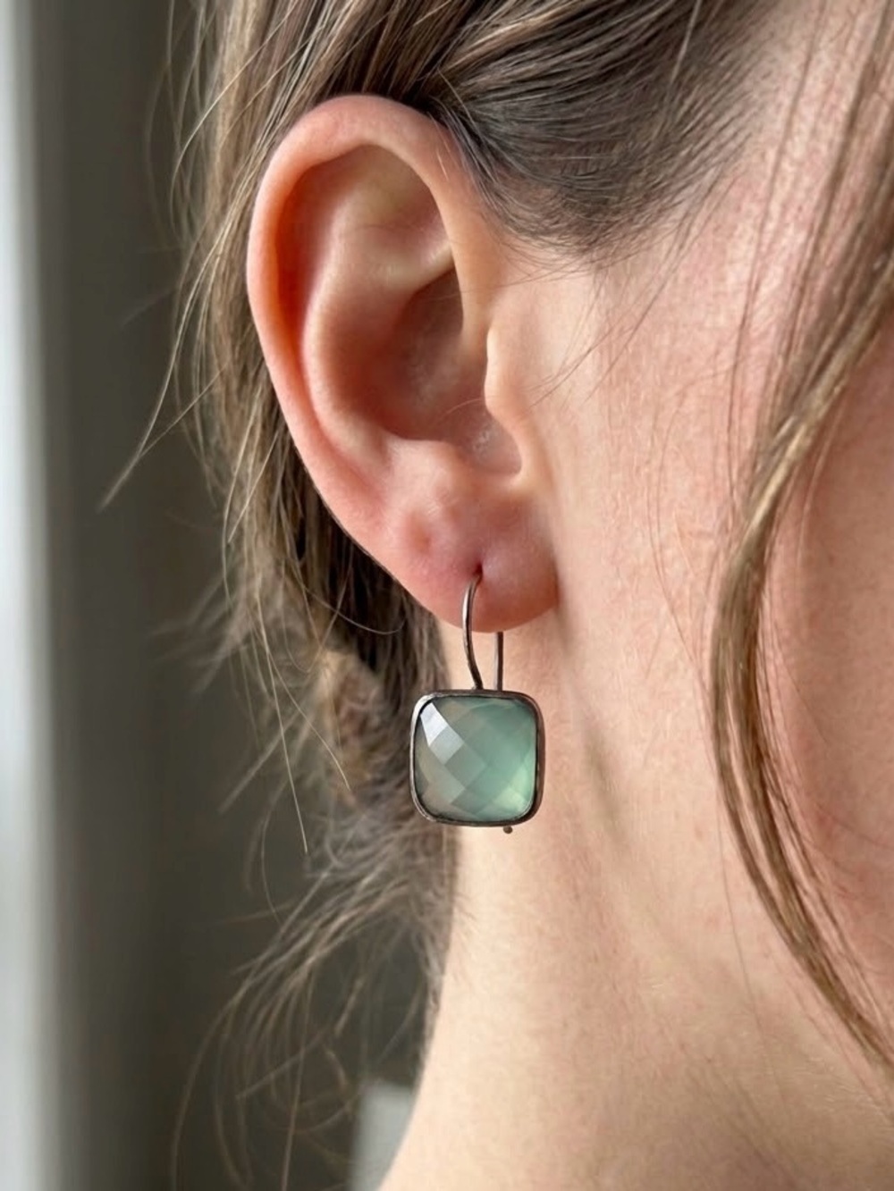 Captivating Light Teal cushion-cut faceted dangle earrings.